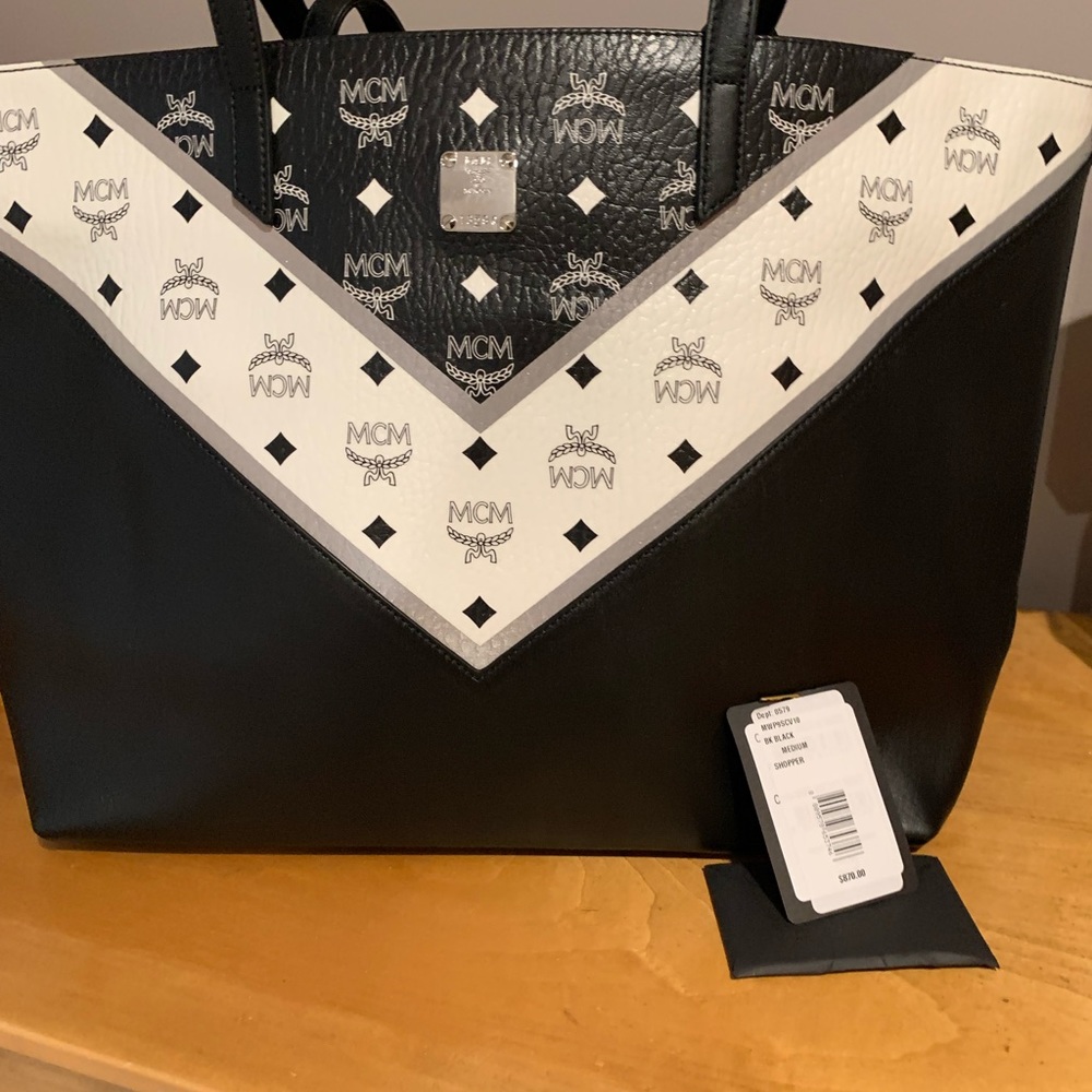 Mcm black leather bag . Used twice! My daughter moved and left it behind